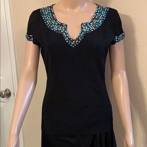 Navy knit top with stunning blue and gold bedding